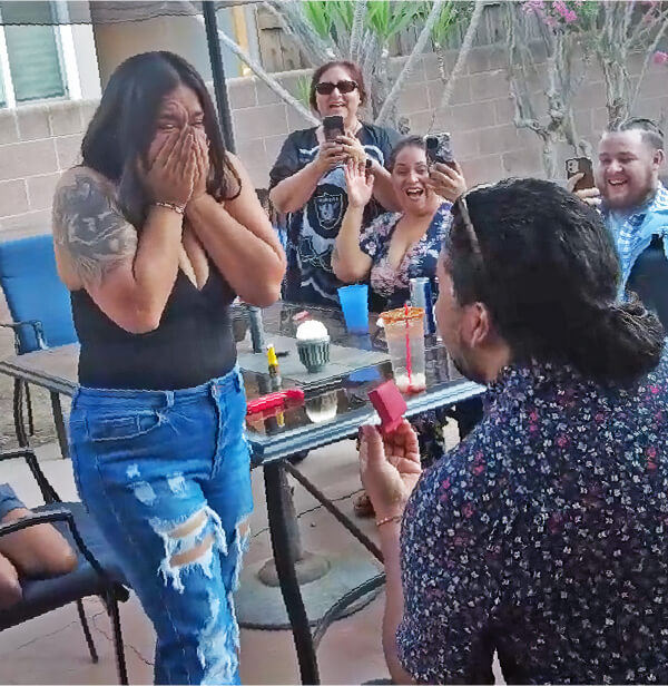 Man proposes to his girlfriend.