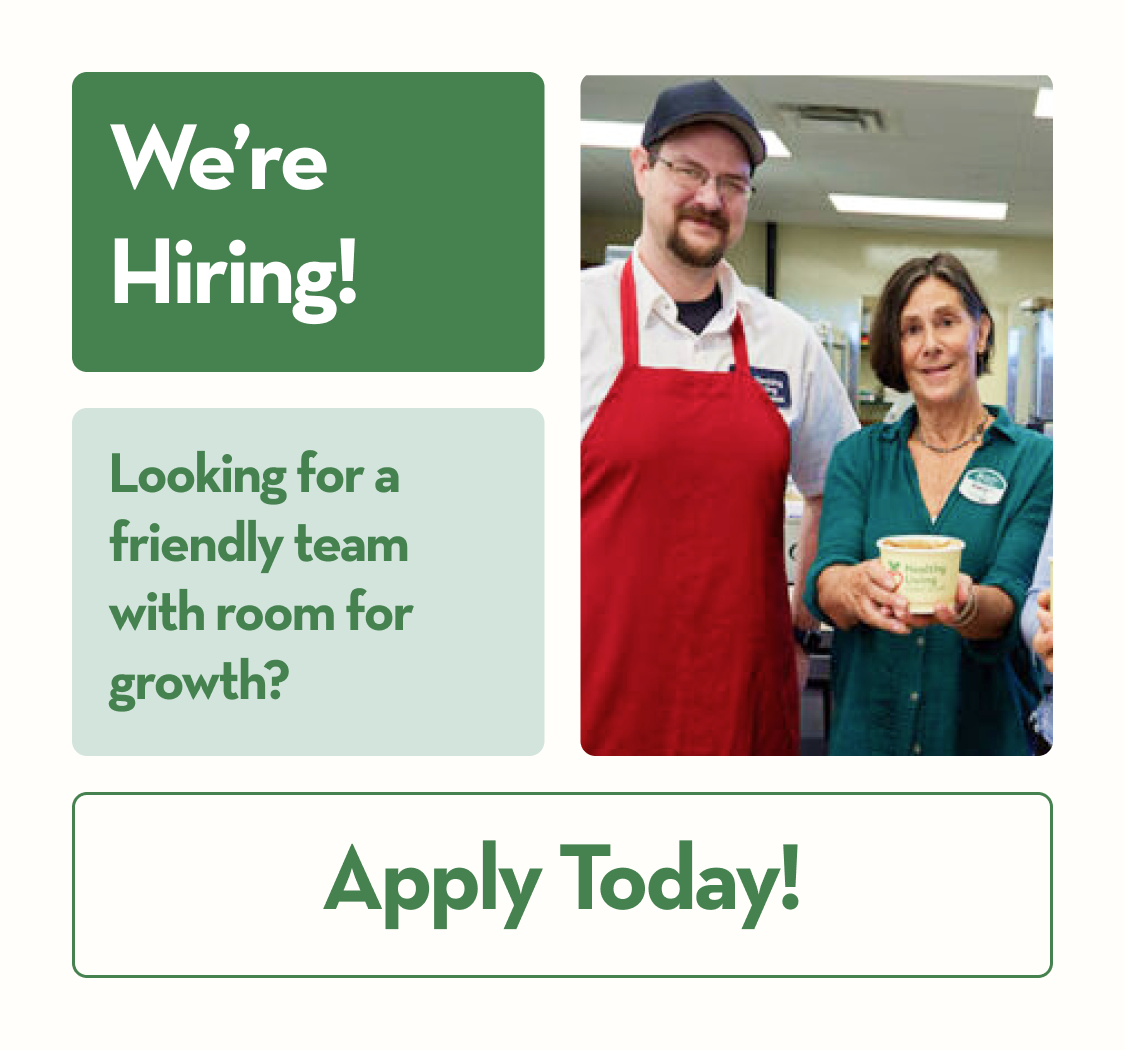 Katy, Nina, and two Healthy Living team members smiling and holding soup.