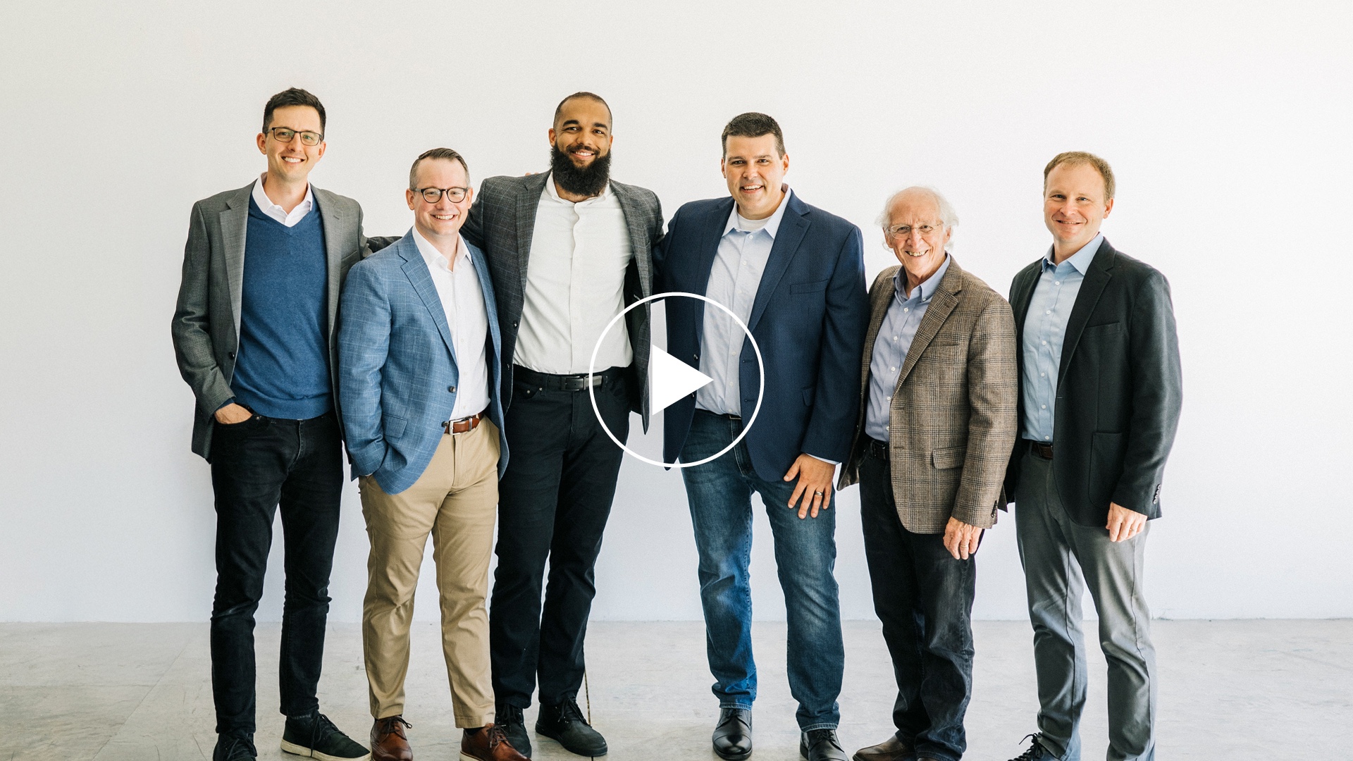 The teaching team at Desiring God pose for a photo against a white background.