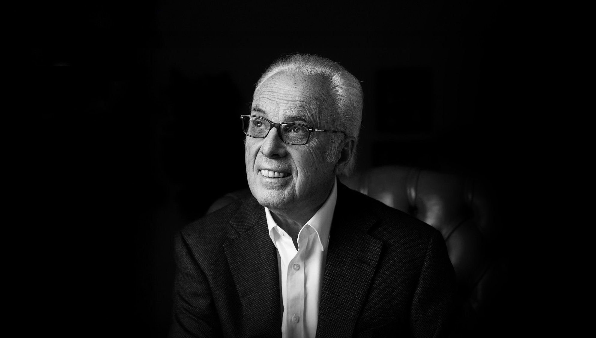 A black and white photo of John MacArthur. A black and white photo of John MacArthur.