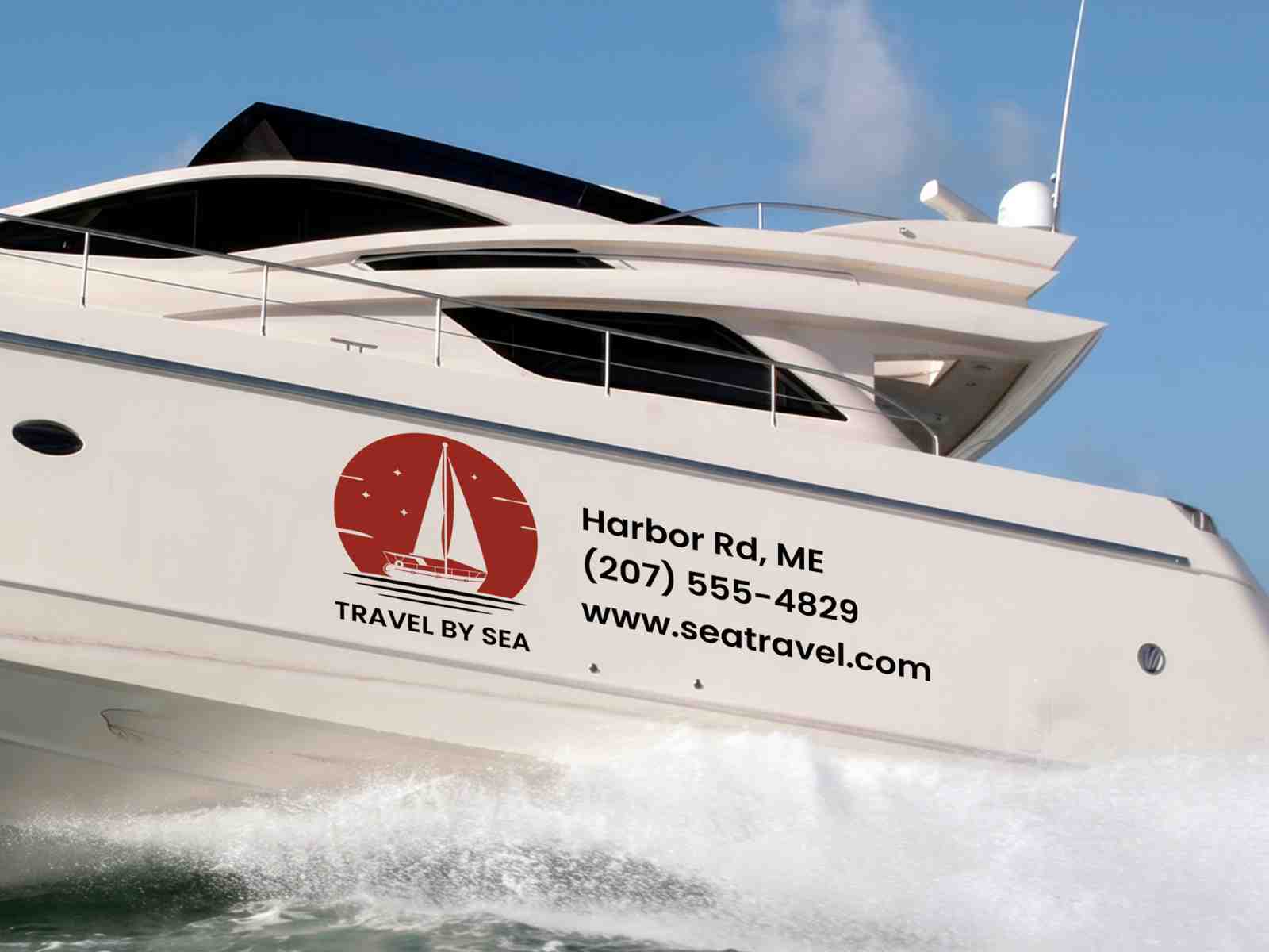 Custom boat decal featuring a sailboat logo, business name, contact information, and website applied to the hull of a white yacht.