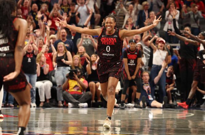 Kelsey Mitchell celebrates in the fourth quarter during a game against the Las Vegas Aces