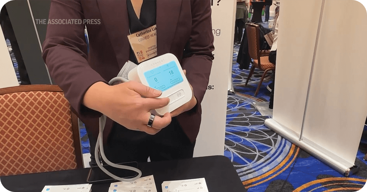 a person showcasing an AI device at a convention