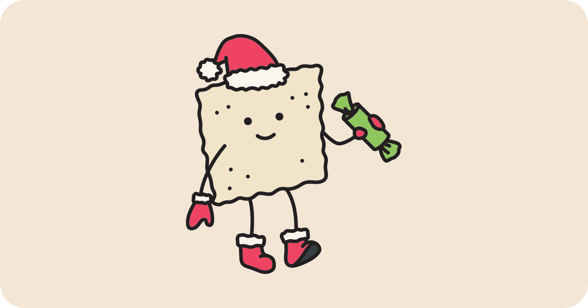 Cracker dressed with santa hat and boots and Christmas cracker