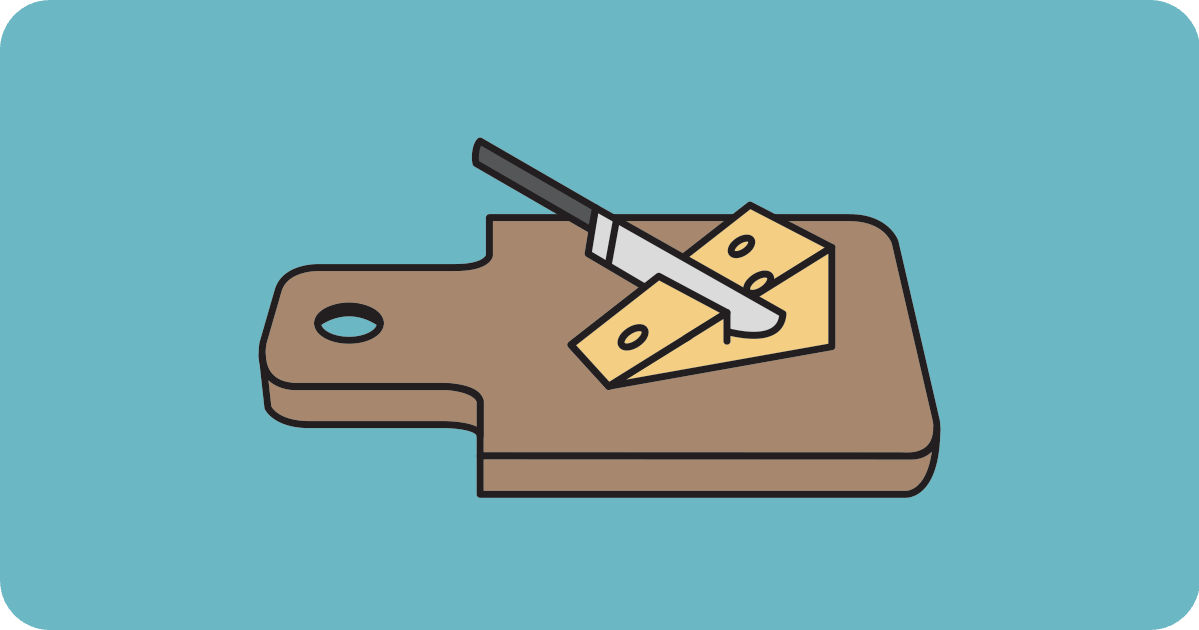 knife and cheese on cutting board
