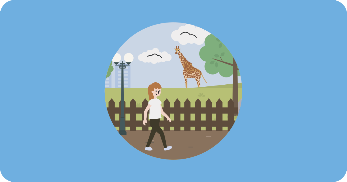 a person walking through a zoo