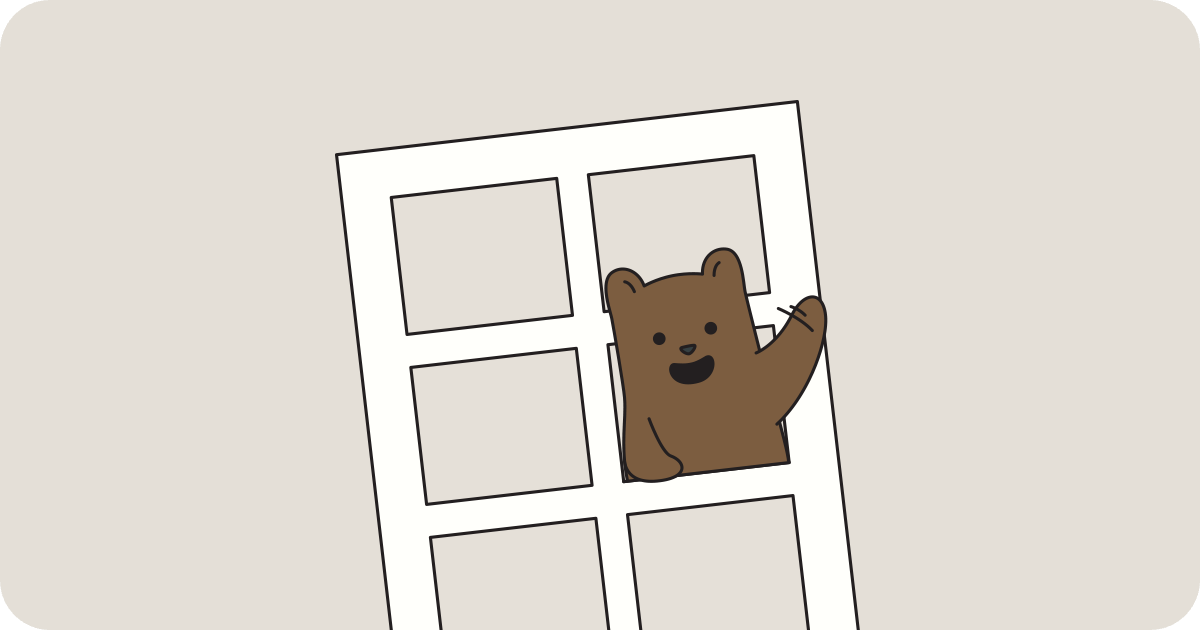 Benji the bear in a window