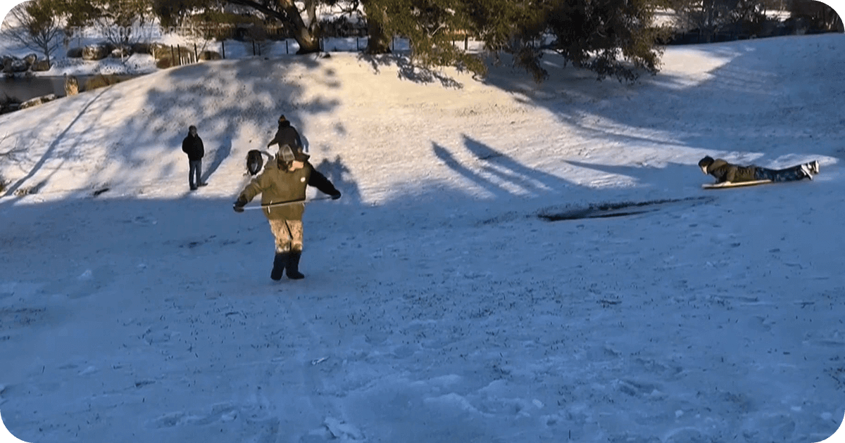 kids sliding down snow hills in Florida
