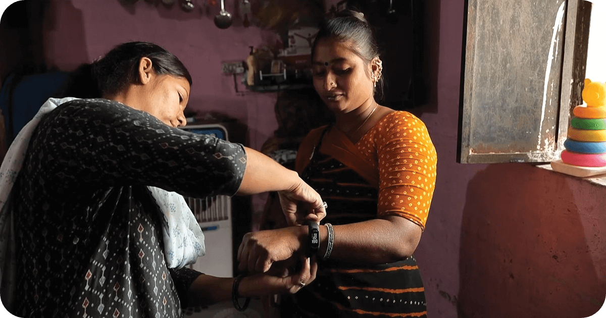 Indian women looking at a smartwatch
